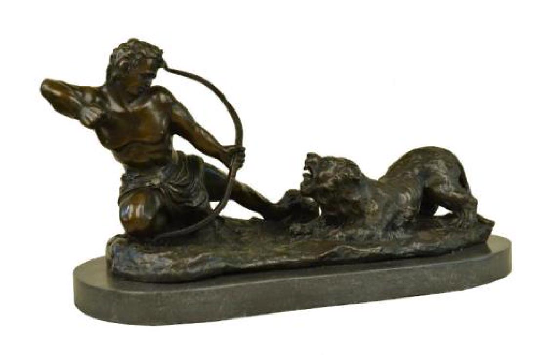 Man With Bow and Arrow Striking Lion Bronze Sculpture: This lovely Sculpture of a man about to strike this lion with a bow and arrow. The lion has his mouth wide open ready to attack the man but the man wont give up to win this battle. The handmade Bronze