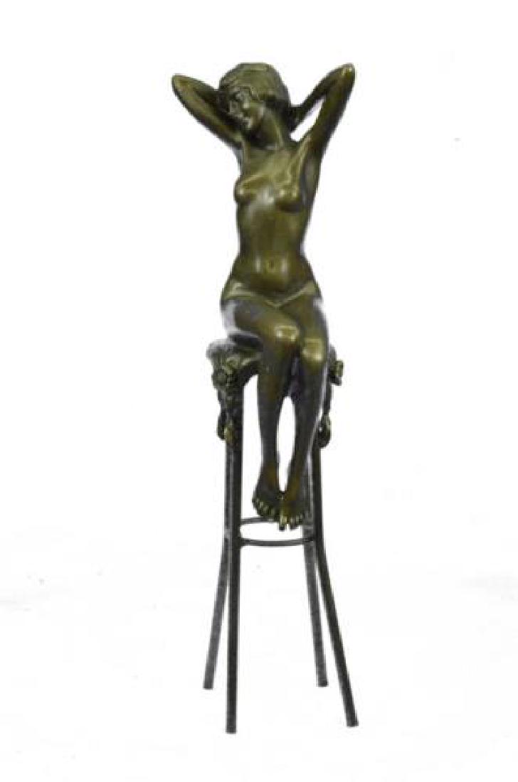 Nude Girl Model Sitting on Chair Bronze Sculpture: Beautiful young Nude woman seated provocatively on a very ornate chair. The whole is hot cast in genuine Bronze Metal this is a very three dimensional Sculpture. The detail of her curvaceous body. Her
