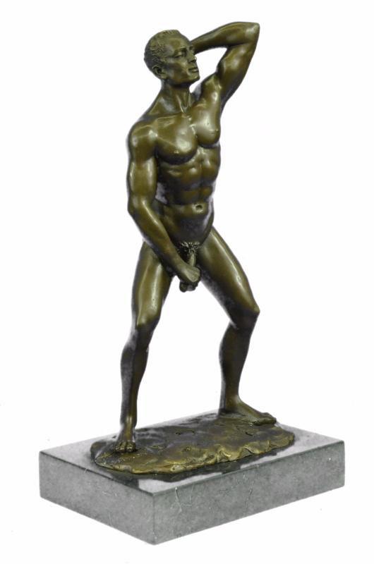 Gay Man Bronze Sculpture: He boldly stands in the buff with a look of fearless determination. This proud gay man exposes his manly erection, proving he knows no shame. Just one example of his gorgeous body. He is lean and musc