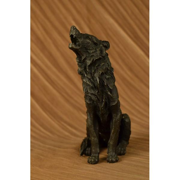 Wolf Howling at The Moon Bronze Sculpture: This is a stunning bronze sculpture featuring a stand-alone wolf. His posture is tall and his head is raised toward the full moon as he releases a high-pitched howl. The artist has captured the detail