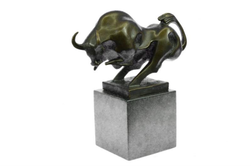 Charging Bull Bronze Sculpture: This magnificent modern and abstract sculpture is of a charging bull. With his head down, his nostrils\'92 flared and his muscles tightened he rears up to stomp the ground before him, releasing a vibr