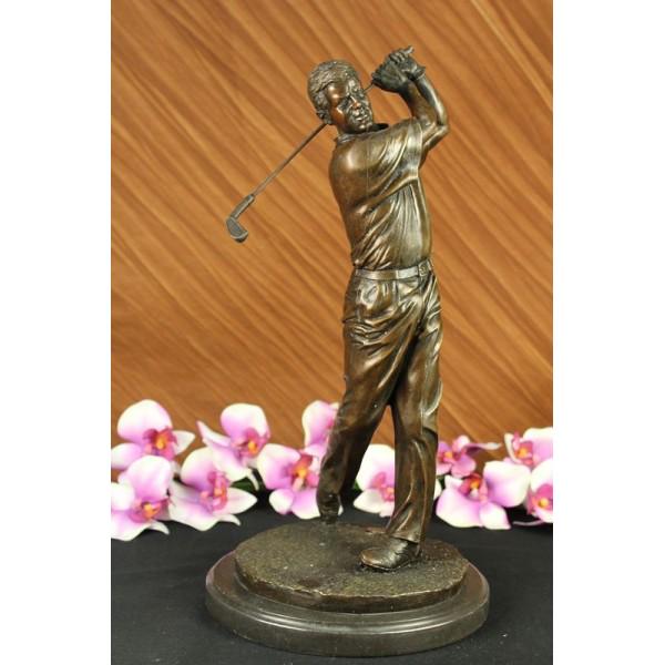 Golfer Trophy Bronze Statue: He watches his golf ball fly high over the rough and into the green. It is the epitome of the perfect swing. He holds his pose as he watches his ball make its way to the hole. His arms are right-angle
