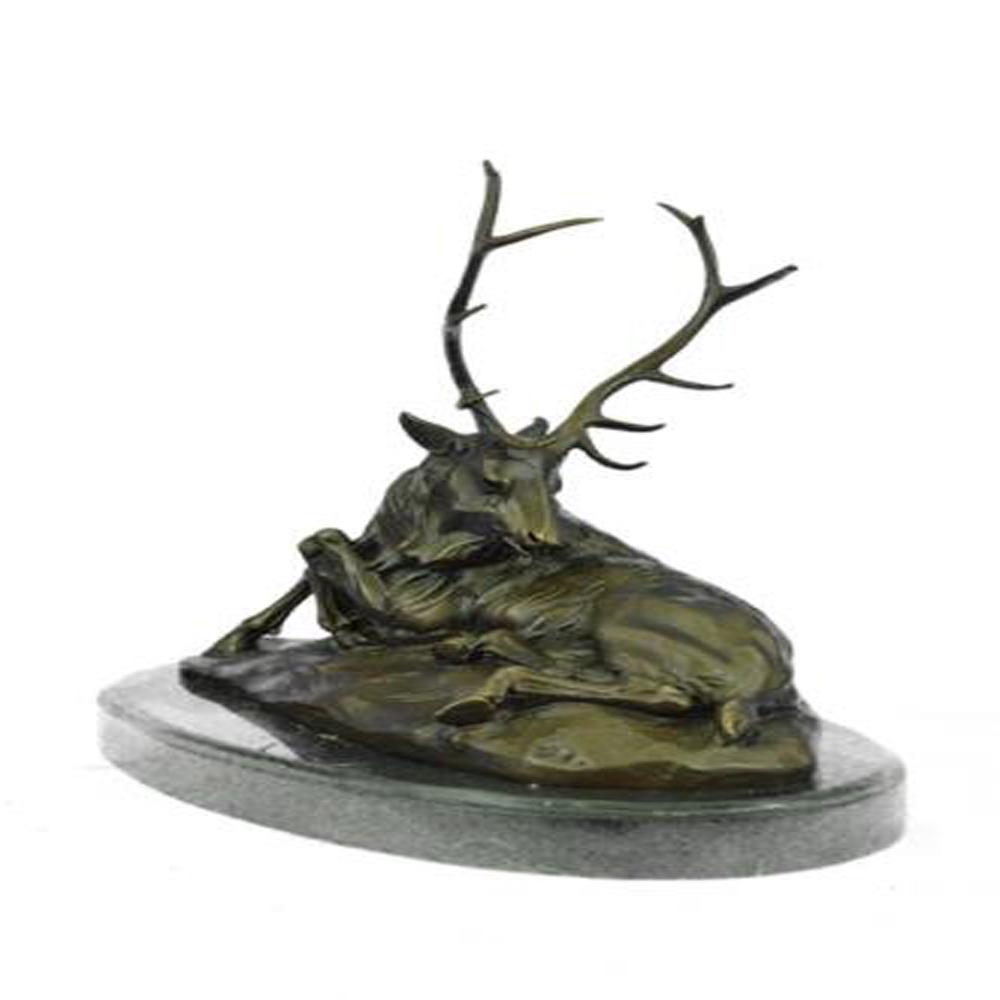 Deer Bronze Sculpture: This old elk takes a rest from the summer day heat in a cool grassy area. He lies down and reaches his massive head around his back to scratch and itch that has been bothering him. He is old and his c
