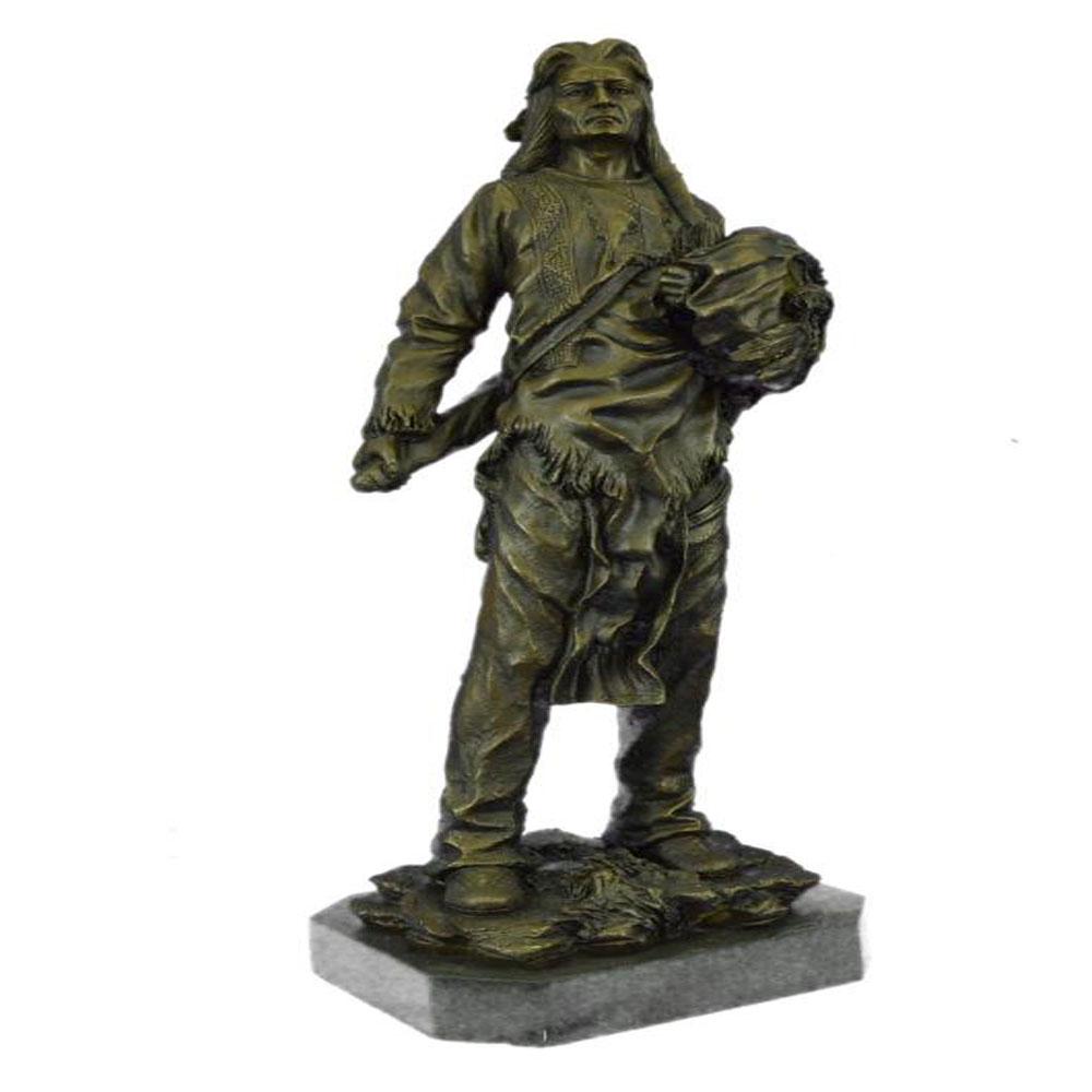 Chief With Shield Gun Full Headdress Bronze Statue: This impressionistic Sculpture of the Indian chief instills a sense of pride, respect, and honor. He has a traditional necklace. His hair is straightened and falls onto his back. His face is old and w
