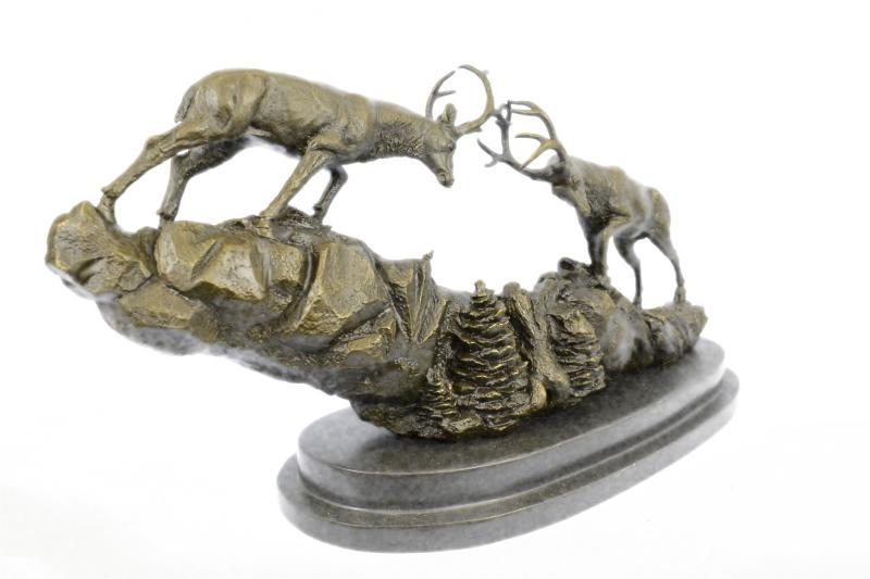 Two Large Fighting Stags Wildlife Cabin Bronze Sculpture: This bronze of fighting Red Deer stags captures the movement in the animals perfectly. The artist is phenomenal for capturing movement in his subjects. This bronze sculpture was molded using the ancie