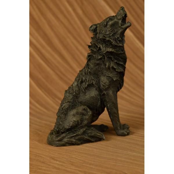 Wolf Howling at The Moon Bronze Sculpture: This is a stunning bronze sculpture featuring a stand-alone wolf. His posture is tall and his head is raised toward the full moon as he releases a high-pitched howl. The artist has captured the detail