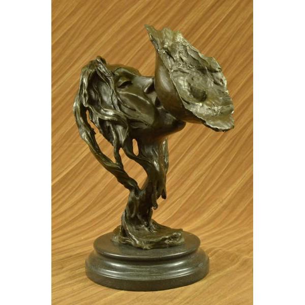 Lesbian Love Erotic Bronze Sculpture: This is a Bronze Sculpture featuring the face of a gorgeous woman embracing her lover. Her eyes are closed as she wraps her lips around the breast of her partner. Waves of her hair twist and shape to