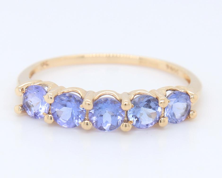 5 Stone Round Brilliant Cut Tanzanite Yellow Gold Band: 5 Stone Round Brilliant Cut Tanzanite 10kt Yellow Gold Band. Total weight of Band 3 Grams. Ring Size 9.5"