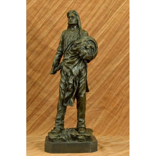 Chief With Shield Gun Full Headdress Bronze Statue: This impressionistic Sculpture of the Indian chief instills a sense of pride, respect, and honor. He has a traditional necklace. His hair is straightened and falls onto his back. His face is old and w