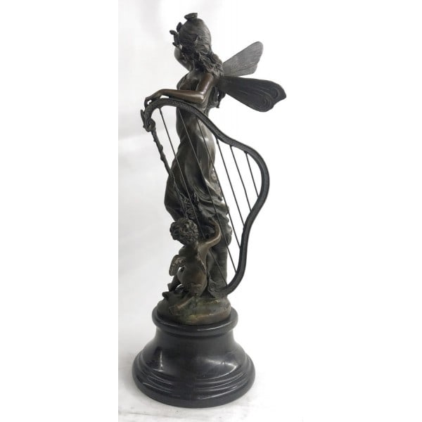 Butterfly Angel Nymph Fairy Bronze Sculpture: A young cherub reaches to a fairy to gain her attention. The beautiful fairy reaches back to the cherub with a delicate to his playful curls. She is holding a musical Harps in this enchanting sculptur