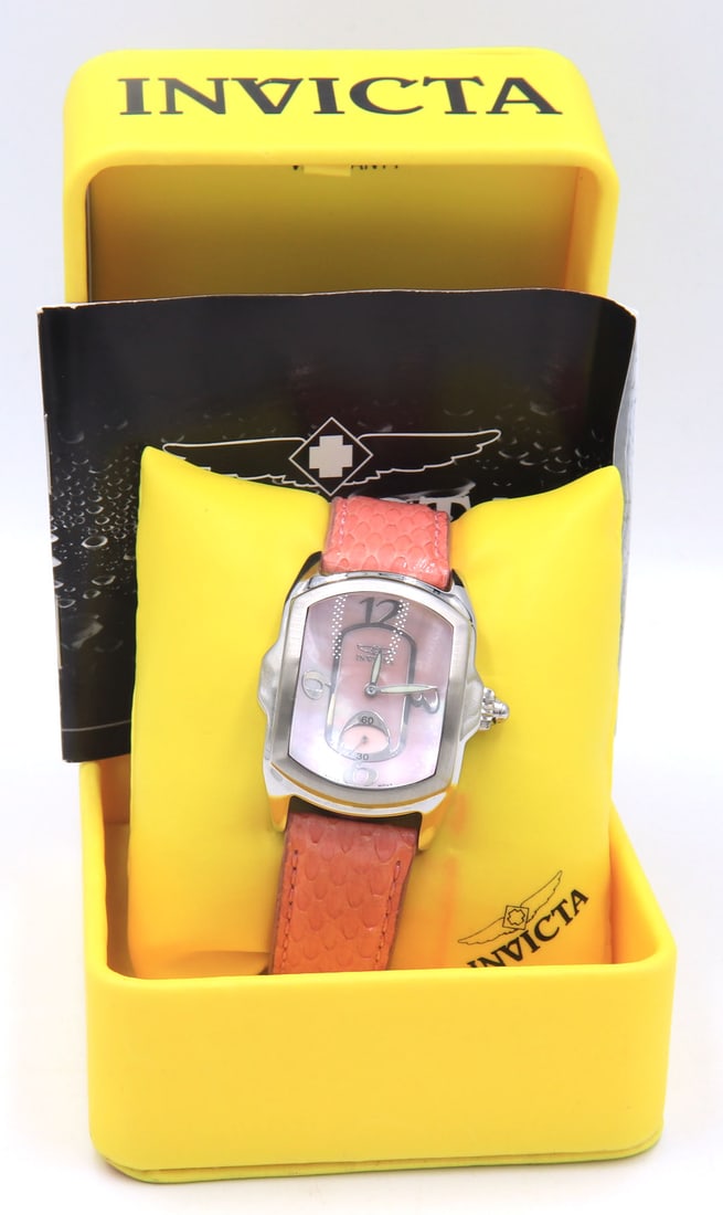 Invicta lady lupah pink dial quartz snake skin strap watch: Invicta lady lupah pink dial quartz snake skin strap watch. Comes with box and booklet. Total weight of watch 70.20 grams.