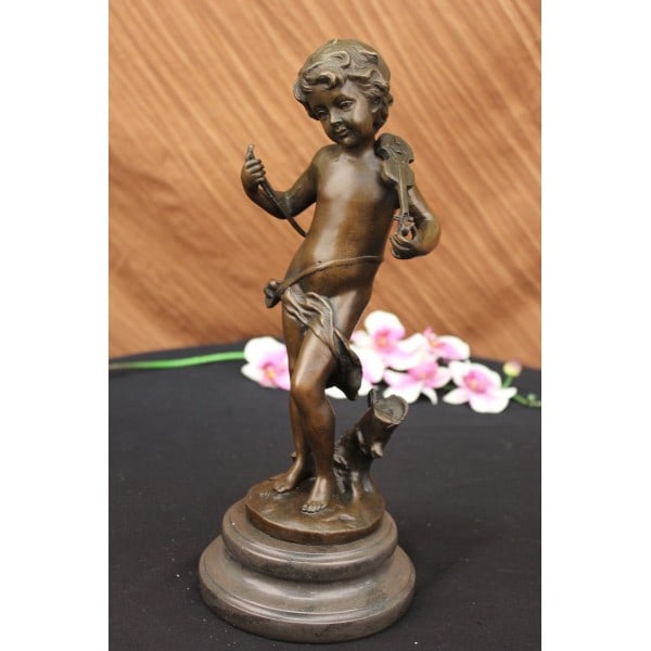 FRENCH MOREAU CHILD MARBLE STATUE VICTORIAN: A beautiful and intricately detailed statue of a young boy placed in front of a broken tree branch, gracefully balancing a violin on his delicate shoulder. He is paused and deep in thought, there is a
