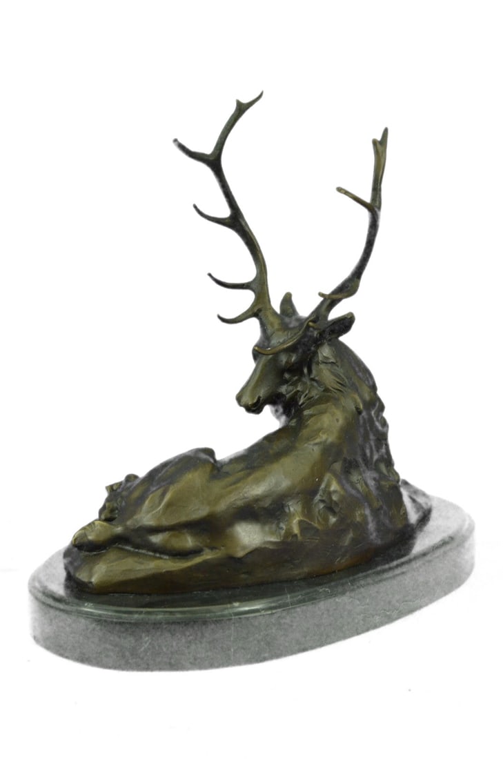 Deer Bronze Sculpture: This old elk takes a rest from the summer day heat in a cool grassy area. He lies down and reaches his massive head around his back to scratch and itch that has been bothering him. He is old and his c