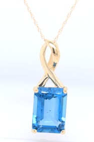 Charming Yellow Gold Emerald Cut Blue Topaz Pendant on Chain Necklace
