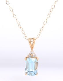 14kt Yellow gold 1.30ct blue topaz and diamond accent pendant on chain necklace