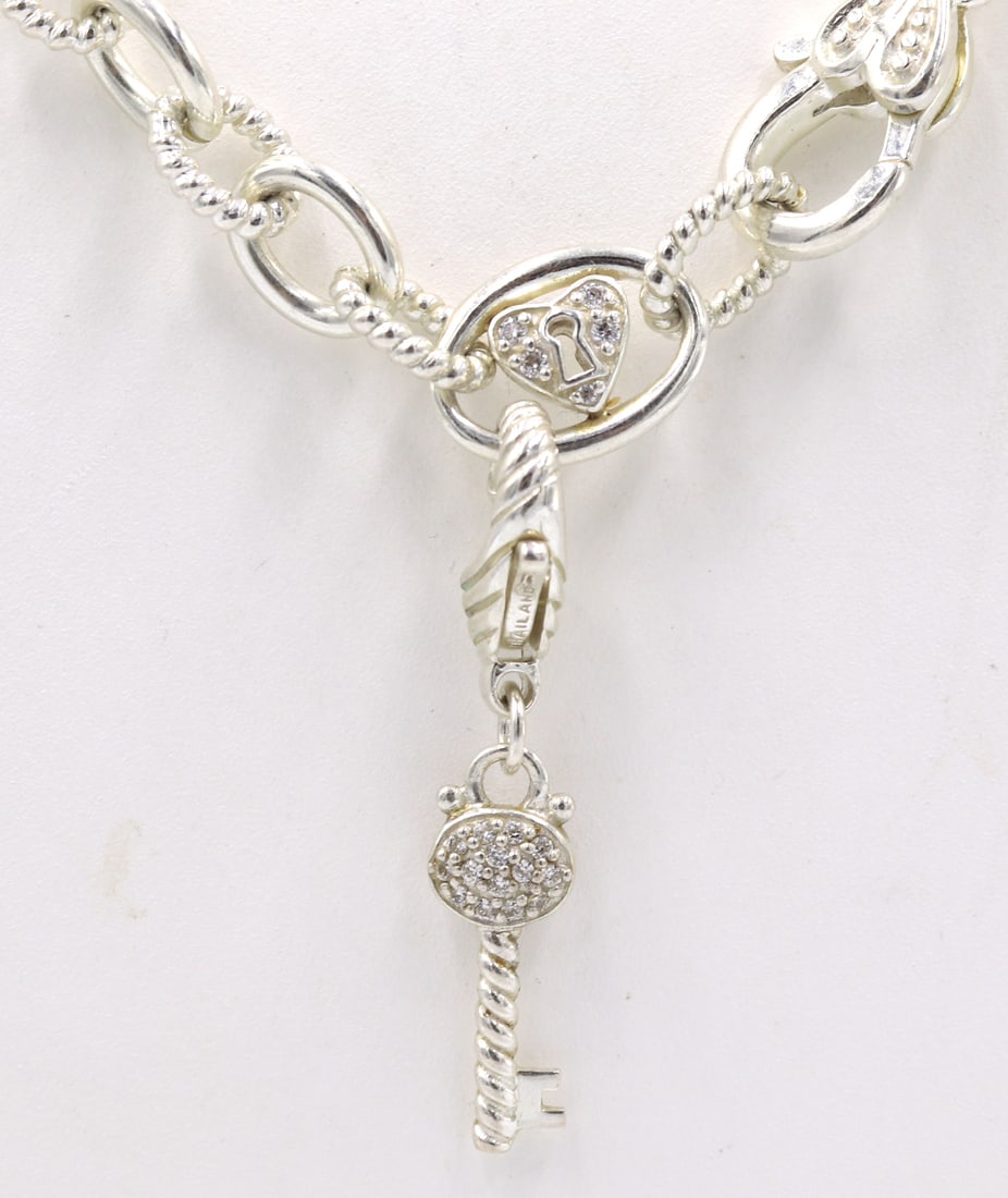 Judith Ripka circle link necklace with Key charm in 925 sterling silver: Judith Ripka circle link 20 inches necklace with Key charm in 925 sterling silver. Total weight of necklace 53.9 grams.