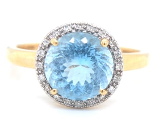 14kt Yellow gold round brilliant cut blue topaz and diamond ring