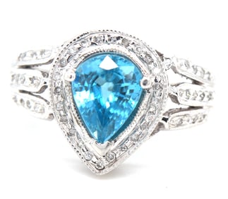 14kt White gold pear shaped blue topaz and diamond ring