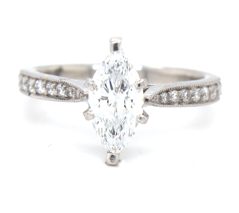 1.36ctw Marquise and Round Diamond Straight Engagement Ring in Platinum: 1.36ctw Marquise and Round Diamond Straight Engagement Ring in Platinum. Center Diamond Carat Weight: Approx. 1.01ct. Clarity: I1. Color: H. Round Diamonds Carat Weight: Approx. 0.35ctw. Ring Size: 6.