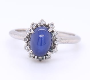 Attractive White Gold oval Blue Star Sapphire and Diamond Halo Ring