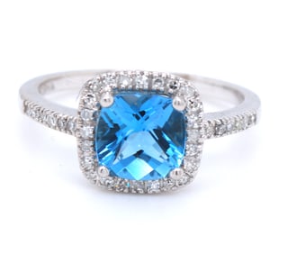 14kt White gold blue topaz and diamond aacent ring