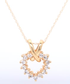 14kt Yellow gold approximate 0.30ctw diamond heart shaped pendant on chain