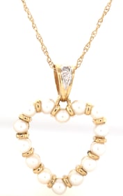 10lt Yellow gold 3mm pearl and diamond heart shaped pendant on chain
