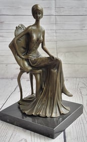 A Maiden Sitting on A Chair Bronze Sculpture