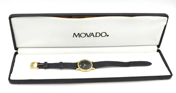 Movado Museum quartz watch: Movado Museum quartz watch with black leather strap. Total weight of watch is 13.80 grams. Comes with box.