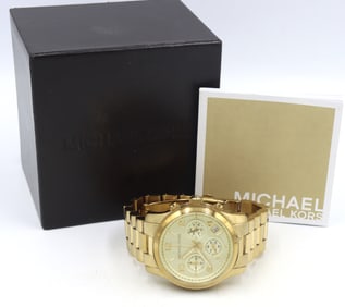 Micheal Kors mid size Chronograph gold tone watch