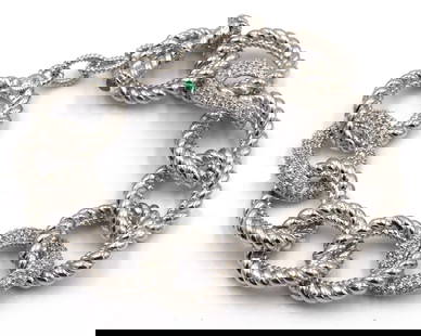 Judith Ripka 925 sterling silver crystal link bracelet: Judith Ripka 925 sterling silver crystal link 7.25-inch bracelet with emerald toggle clasp. The total weight of the bracelet is 72 grams.
