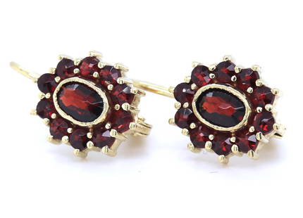 14kt Yellow gold Garnet cluster dangle earrings: 14kt Yellow gold Garnet cluster dangle earrings. Total weight of earrings is 3.70 grams.