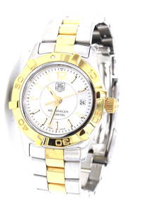 Tag Heuer Aquaracer 2000 quartz 2 tone silver dial watch: Ladies Tag Heuer Aquaracer 2000 quartz 2 tone silver dial 6.25 inches watch. Total weight of watch is 63.40 grams.