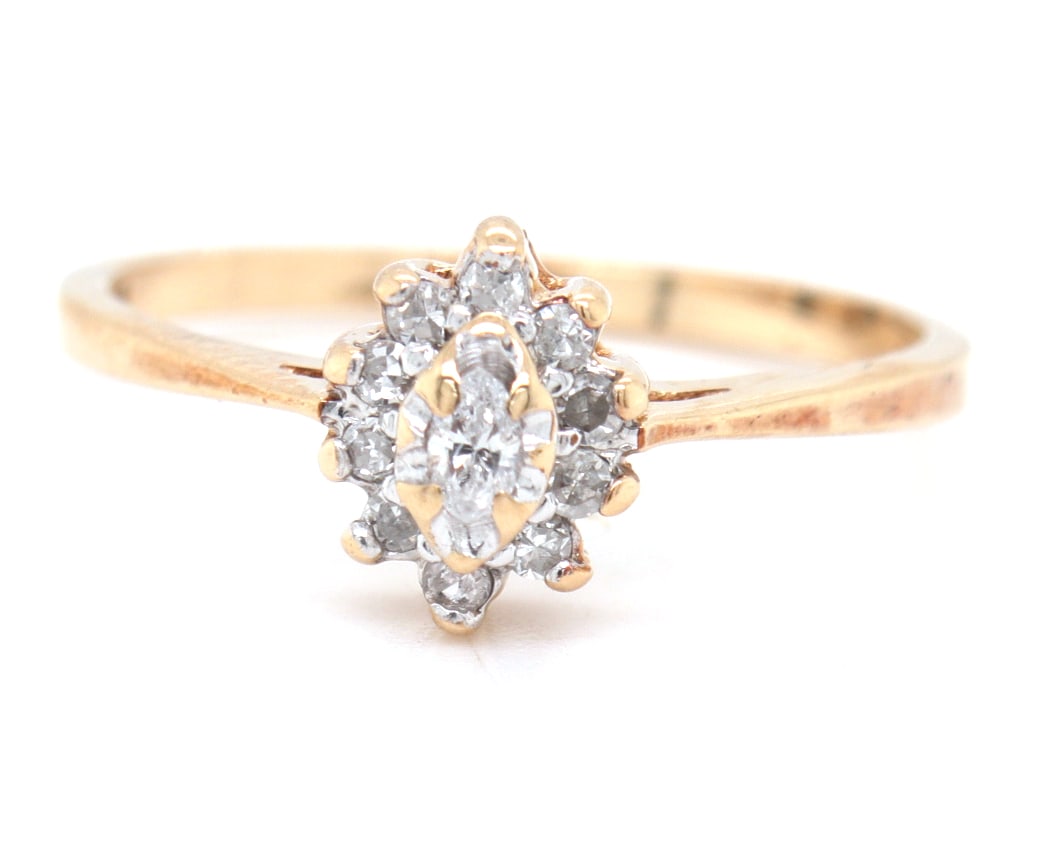 10kt Yellow gold 0.15ctw marquise and round brilliant cut diamond cluster ring: 10kt Yellow gold approximate 0.15ctw marquise and round brilliant cut diamond cluster ring. Total weight of ring is 1.60 grams. Ring size 6"