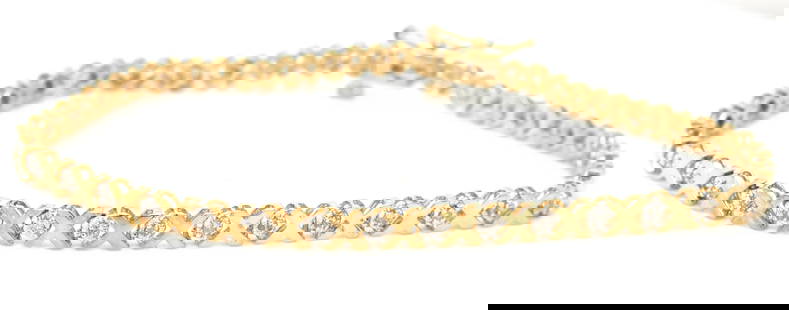 10kt Yellow gold diamond X link bracelet: 10kt Yellow gold diamond X link 7-inch bracelet. The total weight of the bracelet is 4.50 grams.