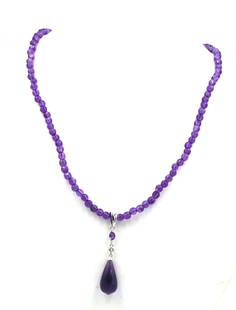 Amethyst pendant on beaded necklace: Amethyst pendant on 18-inch beaded necklace with 14kt white gold clasp. The total weight of the necklace is 13.4 grams.