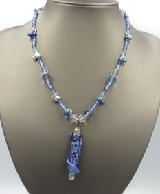 Blue and white crystal rhinestone pendant on beaded necklace