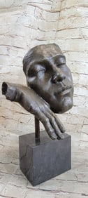 Resting Man Bronze Statue