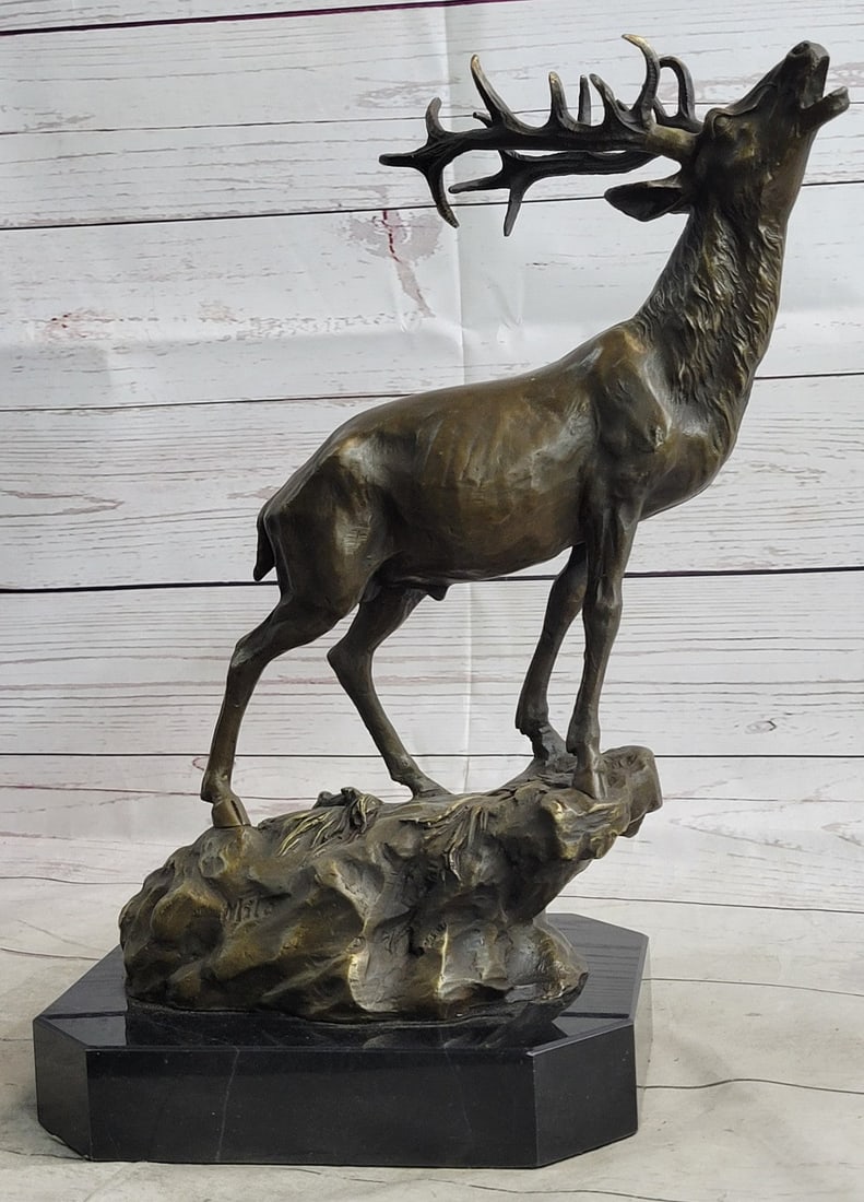 Animal Edition Bronze Sculpture: The Reindeer Caribou can be envisioned in the tundra of a north county belting out an echo of vocals that billow out in white breaths in the cold air. The bronze sculpture was cast using the archaic m