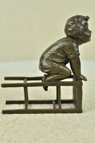Playful Little Boy on Chair Bronze Sculpture