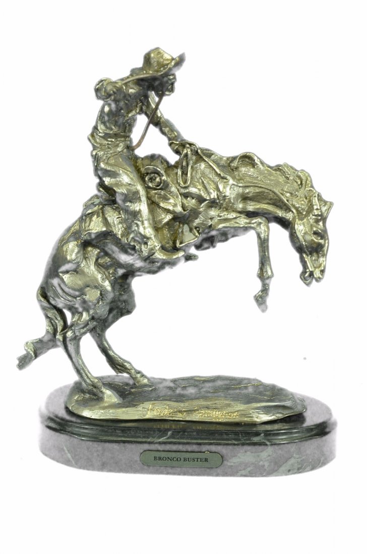 Silver plated Bronco Buster White Bronze Sculpture on: A Great American Classic, This Statue Is Of A Cowboy On Horse Moving Fast Through The Wild Wild West! The Horse Is Standing High On His Hind Legs Ready To Gallop With Some Serious Speed. The Cowboy Is