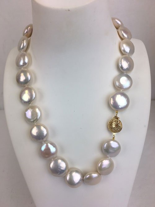 18 inch 24 large coin fresh water pearl necklace: 18 inch 24 large coin fresh water pearl necklace with beautiful luster in white color. Include stunning 14K fishhook clasp. Size 18mm X 16mm.