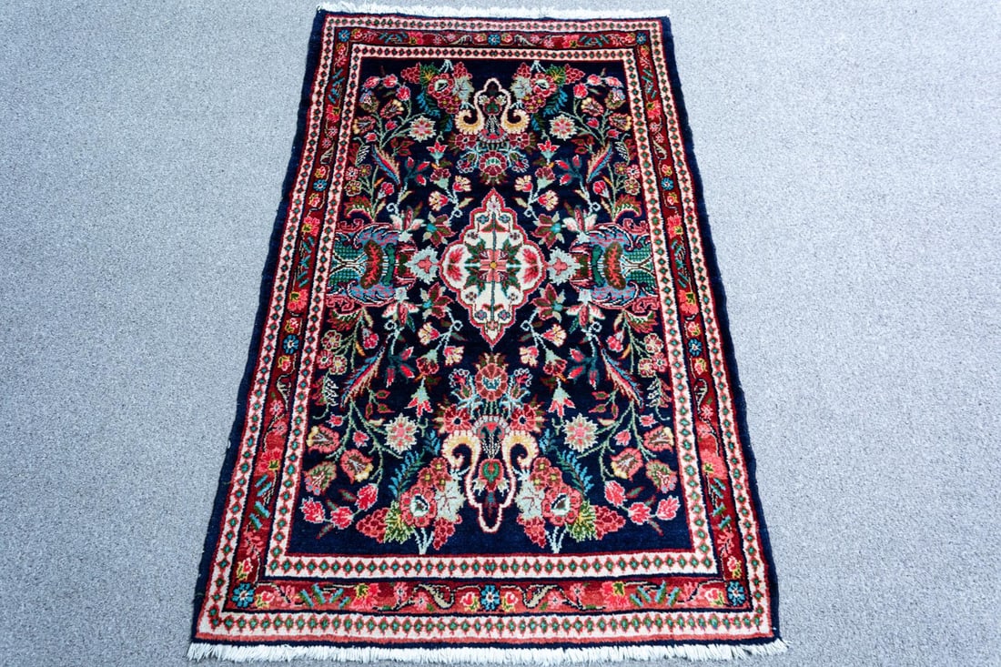 Authentic Persian Hosseinabad 3.10x5.2: Outstanding handmade Persian Hosseinabad rug. Size 3.10x5.2 ft, made of fine quality baby lamb's wool pile on cotton foundation. Incorporating a high detailed floral pattern in a dark background, with
