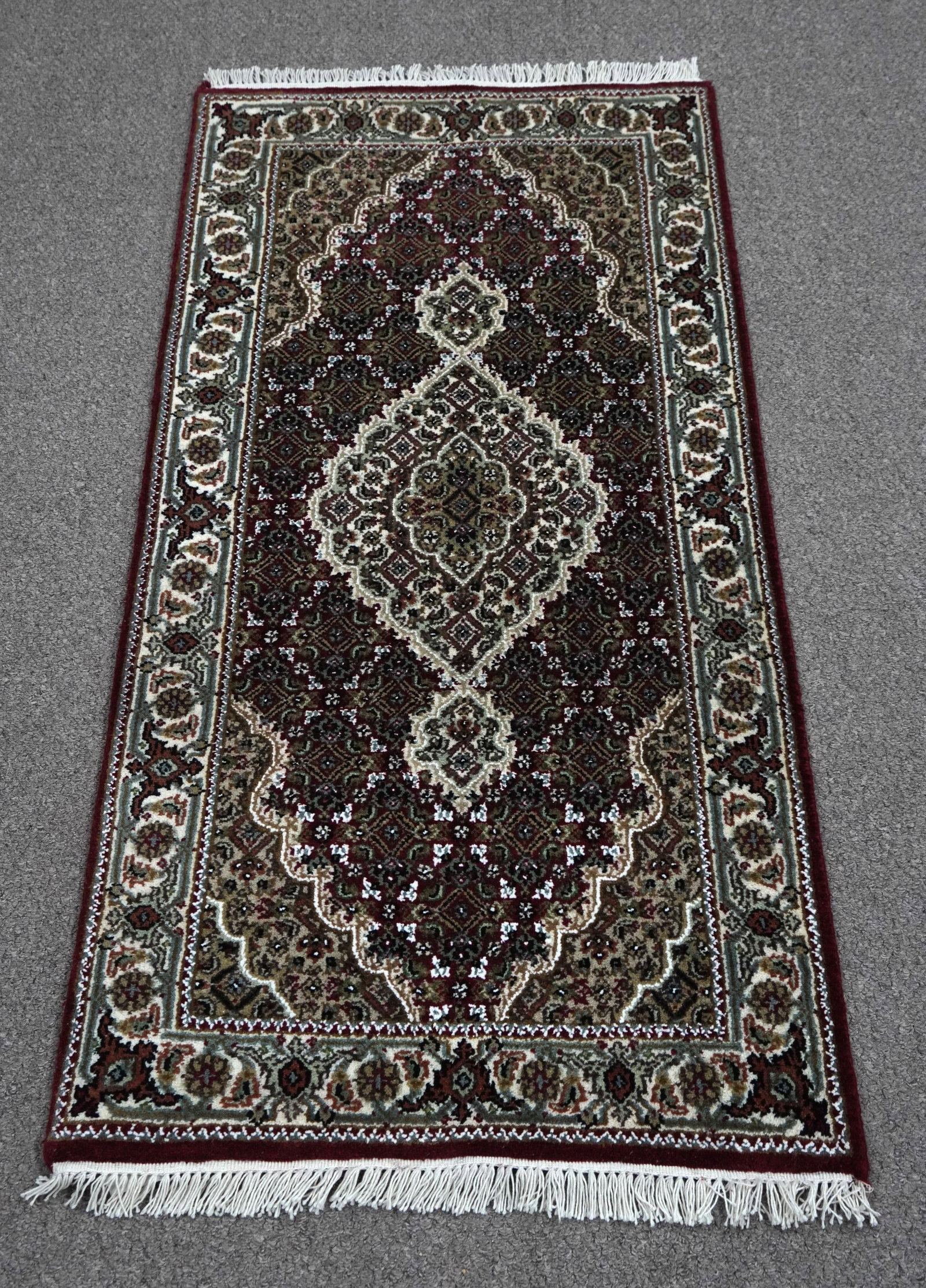 Handmade Tabriz Fish Design 2.5x4.10: Handmade Tabriz Fish Design Rug. Size 2.5x4.10 ft., made of quality wool with silk highlights pile on cotton foundation, finished off beautifully with a floral borders. Hand woven in India.