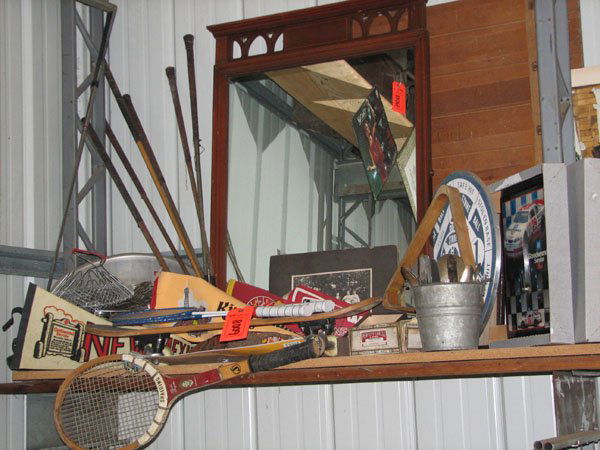 COLLECTION OF SPORTING GOODS, TENNIS RACKET, SKAT: COLLECTION OF SPORTING GOODS, TENNIS RACKET, SKATEBOARD, BASEBALL PENDANTS, NASCAR CLOCK, SILVERWARE, DARTBOARD, WALL MIRROR, VINTAGE GOLF CLUBS, LARGE STAINLESS STEEL BOWL