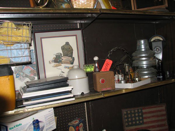 PARKING METER, OLD OIL CANS, PICTURE FRAMES, STEE: PARKING METER, OLD OIL CANS, PICTURE FRAMES, STEERING WHEEL MADE OF CHAIN, AND TRACTOR WHEEL COVER, 2 CAT BEDS AND A COOLER