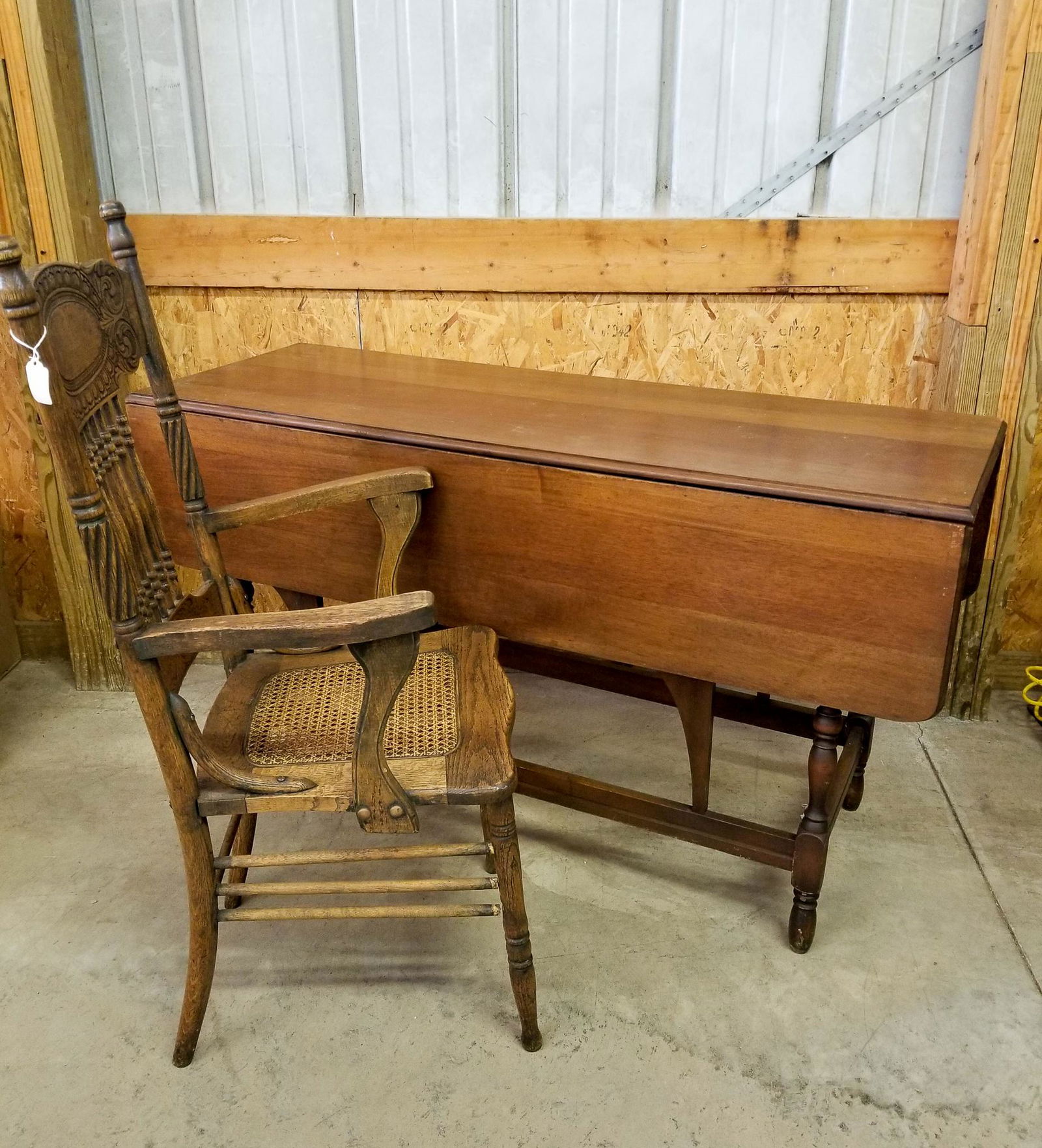 Drop Leaf Table and Pressback Cane Chair: Drop Leaf Table and Pressback Cane Chair Size 30" x 54" x 19" Literature Brooks Auction is not responsible for outbids. Questions? Call the office at (856) 694-2960 or email us directly at info@broo