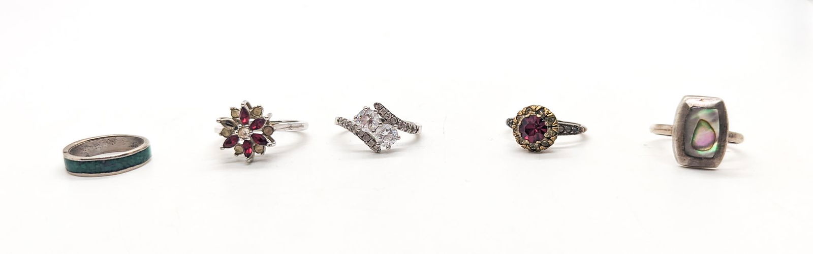 Five Rings: (5) Rings: (3) rings marked sterling, tw: 6.6g, (1) marked 18k HGE, (1) unmarked, marked "Hecho en Mexico" Literature Brooks Auction is not responsible for outbids. Questions? Call the office at (856