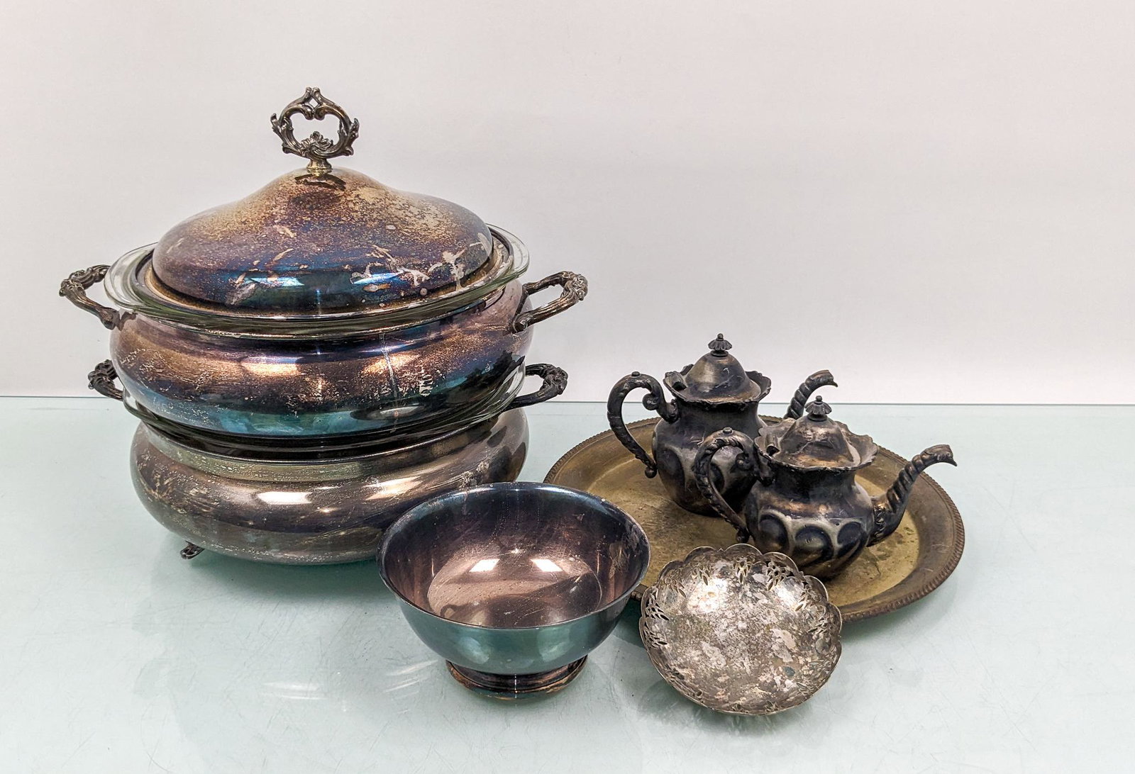 Silver Plated Serveware: Silver Plated Serveware: large serving dishes with pyrex glass interiors - plates - creamers - and more Literature Brooks Auction is not responsible for outbids. Questions? Call the office at (856) 6