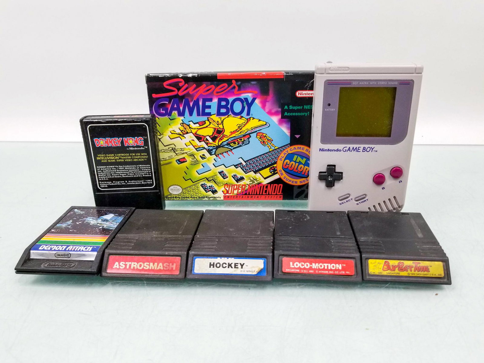 Nintendo GameBoy, Super GameBoy in Box, and Intellivision Games: Nintendo GameBoy, Super GameBoy in Box, and Intellivision Games: original Nintendo GameBoy with Super Mario Land 2 - Super GameBoy in original packaging - six Intellivision games including Burgertime,